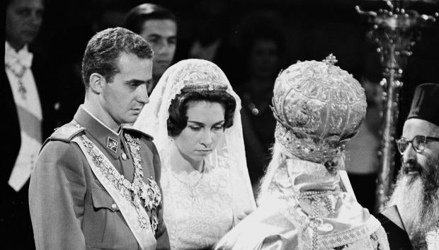 Prince Juan Carlos of Spain and his bride Princess Sophia of Greece, stand before Archbishop Chrysostomos, Primate of Greece, during Greek Orthodox marriage ceremony in Athens, Greece, May 14, 1962. (AP Photo)