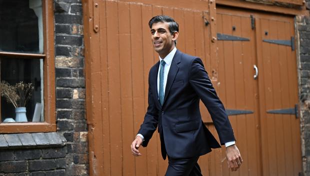 Britain's Chancellor of the Exchequer Rishi Sunak arrives for a regional cabinet meeting  in Stoke on Trent, England, Thursday, May 12, 2022.