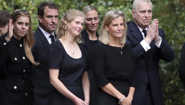 From left, Britain's Princess Beatrice, Peter Phillips, Lady Louise Windsor, Zara Tindall, Sophie Countess of Wessex and Prince Andrew,gesture to the members of the public after looking at the floral tributes for Queen Elizabeth II, as others look on, outside the gates of Balmoral Castle in Aberdeenshire, Scotland Saturday, Sept. 10, 2022. Queen Elizabeth II, Britain's longest-reigning monarch and a rock of stability across much of a turbulent century, died Thursday after 70 years on the throne. She was 96. (AP Photo/Scott Heppell) *** Local Caption *** .