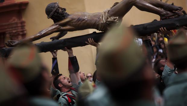 Members of the Spanish Legion, an elite unit of the Spanish Army, hold the El Cristo de la Buena Muerte, or Christ of the Good Death, during a ceremony ahead to the procession in Malaga, Southern Spain, Thursday , April 5, 2012.