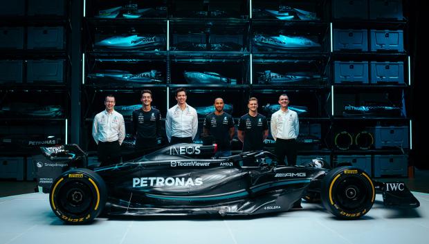 A handout image released by Mercedes shows the team's British driver George Russell (2L), Team principal Toto Wolff (3L), British driver Lewis Hamilton (3R) and reserve driver German driver Mick Schumacher (2R) posing with their new Mercedes-AMG F1 W14 E Formula One racing car during their 2023 season launch, in Silverstone on February 15, 2023. (Photo by MERCEDES / AFP) / RESTRICTED TO EDITORIAL USE - MANDATORY CREDIT "AFP PHOTO / MERCEDES-AMG" - NO MARKETING - NO ADVERTISING CAMPAIGNS - DISTRIBUTED AS A SERVICE TO CLIENTS