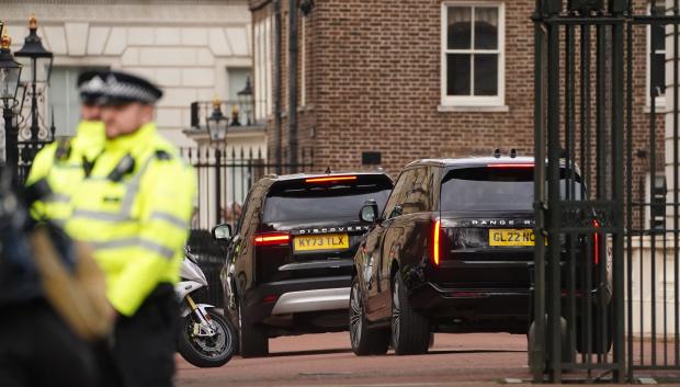 Two black SUVs, believed to be carrying Prince Harry, arrive at Clarence House, London, following the announcement of King Charles III's cancer diagnosis on Monday evening. The King has been diagnosed with a form of cancer and has begun a schedule of regular treatments, and while he has postponed public duties he "remains wholly positive about his treatment", Buckingham Palace said. Picture date: Tuesday February 6, 2024.