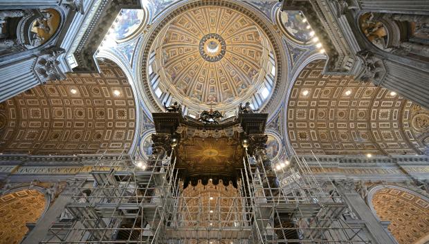 A scaffolding is mounted around the baldachin of St. Peter's basilica to start its restoration on February 21, 2024 in the Vatican. The large Baroque sculpted bronze canopy over the high altar of St. Peter's Basilica by artist Gian Lorenzo Bernini dated from 1634. (Photo by Andreas SOLARO / AFP)