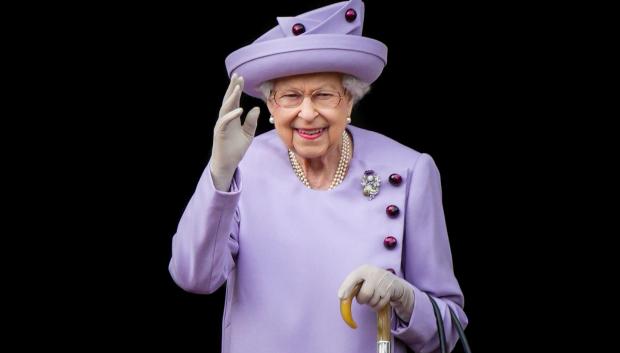 Queen Elizabeth II waves during an Armed Forces Act of Loyalty Parade in Edinburgh, UK, 28 June 2022.