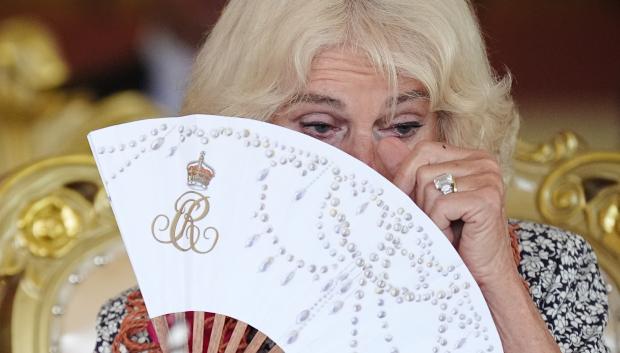 Queen Camilla wipes her eye after crying with laughter during a farewell ceremony at Siumu Village on the final day of the royal visit to Australia and Samoa. Picture date: Saturday October 26, 2024. *** Local Caption *** .