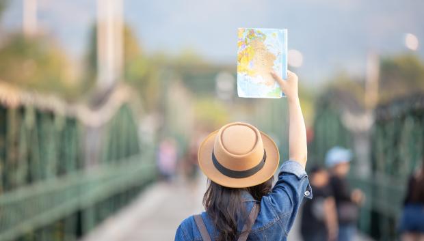 Female tourists with a travel map on hand