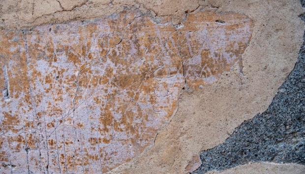 La inscripción en el corredor de Pompeya