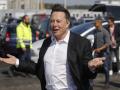 (FILES) In this file photo taken on September 03, 2020 Tesla CEO Elon Musk gestures as he arrives to visit the construction site of the future US electric car giant Tesla, in Gruenheide near Berlin. - Tesla chief Elon Musk told investors on October 7, 2021 that the leading electric vehicle maker is moving its headquarters from Silicon Valley to Texas. "I'm excited to announce that we're moving our headquarters to Austin, Texas," Musk said at an annual shareholders meeting. (Photo by Odd ANDERSEN / AFP)