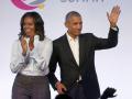 FILE - In this Oct. 31, 2017, file photo, former President Barack Obama, right, and former first lady Michelle Obama appear at the Obama Foundation Summit in Chicago.