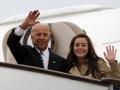 U.S. Vice President Joseph Biden, left, waves with his granddaughter Naomi Biden as they walk out from Air Force Two upon arrival at the airport in Beijing, China, Wednesday, Aug. 17, 2011. (AP Photo/Ng Han Guan, POOL)