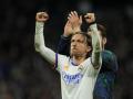 Real Madrid's Luka Modric celebrates after his team qualified for the semifinals, at the end of the Champions League, quarterfinal second leg soccer match between Real Madrid and Chelsea at the Santiago Bernabeu stadium in Madrid, Spain, Tuesday, April 12, 2022. (AP Photo/Manu Fernandez) *** Local Caption *** .