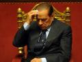 Silvio Berlusconi, antiguo primer ministro italiano, limpiándose el sudor