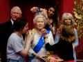 Studio artists Luisa Compobassi (left), Caryn Mitanni (back) and Jo Kinsey (right) make their final touches to the wax figure of Queen Elizabeth II at Madame Tussauds London ahead the Platinum Jubilee celebrations. Picture date: Wednesday May 25, 2022.