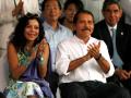 Nicaragua's President-elect Daniel Ortega and his wife, Rosario Murillo, applaud at the start of his inauguration ceremony in Managua, Wednesday Jan. 10, 2007. In background are the presidents of El Salvador, Tony Sacca, right, Honduras, Manuel Zelaya, second from right, and Costa Rica, Oscar Arias, third from right. Ortega, who ruled Nicaragua in the 1980's, returned to power after winning last November's presidential elections. (AP Photo/Dario Lopez-Mills)© RADIAL PRESS