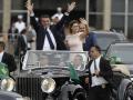 Brazil's new President Jair Bolsonaro and his wife Michelle Bolsonaro wave to the crowd in Brasilia, Brazil, Tuesday, Jan. 1, 2019.  *** Local Caption *** .