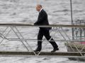 Russian President Vladimir Putin arrives to attend the military parade during Navy Day celebrations, in the Neva River, St.Petersburg, Russia, Sunday, July 31, 2022.  *** Local Caption *** .