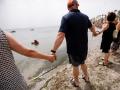 Una hilera de personas participa en una cadena humana por la recuperación del Mar Menor, en la Playa en Los Alcázares