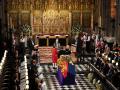 The Imperial State Crown is removed from the coffin of Britain's Queen Elizabeth II during a committal service at St George's Chapel, Windsor Castle, in Windsor, England, Monday, Sept. 19, 2022. (Joe Giddens/Pool Photo via AP) *** Local Caption *** .