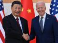 US President Joe Biden (R) and China's President Xi Jinping (L) shake hands as they meet on the sidelines of the G20 Summit in Nusa Dua on the Indonesian resort island of Bali on November 14, 2022. (Photo by SAUL LOEB / AFP)