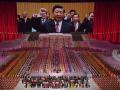 FILE - Chinese President Xi Jinping is seen leading other top officials pledging their vows to the party on screen during a gala show ahead of the 100th anniversary of the founding of the Chinese Communist Party in Beijing, June 28, 2021. Xi was dubbed "chairman of everything" after he put himself in charge of economic, propaganda and other major functions. That reversed a consensus for the ruling inner circle to avoid power struggles by sharing decision-making. (AP Photo/Ng Han Guan, File) 
China