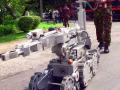 A training official operates a remote control robot part of new bomb disposal equipment just supplied to the Thai police force at the Rose Garden Resort Thursday, Oct. 31, 2002 in Nakhon Pathom, Thailand, where the second round of Sri Lanka peace talks began Thursday. The talks, brokered by Norway, are being hosted by Thailand in an effort to end the 19-year separatist conflict in Sri Lanka that has claimed 65,000 lives. (AP Photo/Sakchai Lalit)