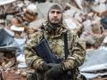 Caesar, 50-year-old, a Russian who joined the Freedom of Russia Legion to fight on the side of Ukraine, poses for a photograph in Dolyna, eastern Ukraine on December 26, 2022. - Freedom of Russia Legion is a Foreign volunteer legion formed in March 2022 with defectors from the Russian Armed Forces, Russian and Belarusian volunteers. (Photo by Sameer Al-DOUMY / AFP)
