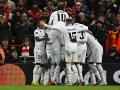 Los jugadores del Real Madrid celebran el cuarto gol, marcado por Benzema