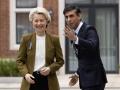Britain's Prime Minister Rishi Sunak (R) greets European Commission chief Ursula von der Leyen as she arrives at the Fairmont Hotel in Windsor, west of London on February 27, 2023, ahead of their meeting. - Britain and the European Union were on Monday poised to agree a crucial overhaul of trade rules in Northern Ireland, in a breakthrough aimed at resetting strained relations since Brexit. (Photo by Dan Kitwood / POOL / AFP)