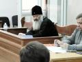 Metropolitan Pavlo (C), the director of the Kyiv-Pechersk Lavra, the ancient cave monastery that has played a crucial role in both Ukrainian and Russian history, sits in a court in Kyiv, on April 1, 2023. - The government announced it would terminate the lease allowing the monks to occupy part of the Kyiv-Pechersk Lavra for free on March 29, 2023, but said the eviction process could take weeks. Despite the church officially breaking ties with the Russian Patriarchate after the invasion of Ukraine last year, Kyiv believes it is still de facto dependent on Moscow. (Photo by Sergii VOLSKYI / AFP)