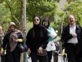 Iranian women walking in a Tehran street