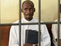 Wealthy and high-profile televangelist Ezekiel Odero, (L) head of the New Life Prayer Centre and Church, sits in the dock before the hearing of his case on suspected  murder, aiding suicide, abduction, radicalisation, crimes against humanity, child cruelty, fraud and money laundering, at the Shanzu law courts in Mombasa on May 4, 2023. - A prominent Kenyan pastor faces a court hearing on May 4, 2023 in connection with the horrific discovery last month of dozens of bodies in mass graves. 
Ezekiel Odero, a wealthy televangelist who boasts a huge following, is being investigated on a raft of charges including murder, aiding suicide, abduction, radicalisation, crimes against humanity, child cruelty, fraud and money laundering.
Prosecutors accuse Odero of links to cult leader Paul Nthenge Mackenzie, who is in custody facing terrorism charges over the deaths of more than 100 people, many of them children. (Photo by SIMON MAINA / AFP)