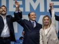 (L-R) Federal Secretary of Italy's Lega Nord party Matteo Salvini, Forza Italia leader Silvio Berlusconi, and leader of the far-right Fratelli d'Italia (Brothers of Italy) party Giorgia Meloni attend their coalition closing campaign rally in Rome. Italy will vote for a new parliament on 25 September 2022. 
elections parties politics
