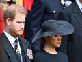 Meghan Markle , Duchess of Sussex, and Prince Harry during the carriage procession for Queen Elizabeth II's state funeral from London to Windsor on 19 September 2022