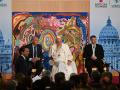 Pope Francis (C) and co-Directors of the NGO Scholas Ocurrentes, Jose Maria del Corral (L) and Enrique Palmeyro (R) speak onstage during the "Eco-Educational Cities" conference organised by Scholas Ocurrentes and aimed at promoting education and sustainability on May 25, 2023 at the Augustinian Patristic Pontifical Institute in Rome. (Photo by Andreas SOLARO / AFP)