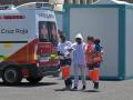 EL PINAR (EL HIERRO), 19/06/2024.- Los servicios de Cruz Roja atienden a una mujer y un bebé de los 63 inmigrantes rescatados a medio día de hoy, por la embarcación de Salvamento Marítimo, Salvamar Ahdara, en aguas cercanas a El Hierro, y trasladados al puerto de La Restinga, en el municipio de El Pinar, en la isla de El Hierro, para ser atendidos por los equipos de emergencia. EFE/Gelmert Finol