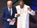 US President Joe Biden (L) stands with Bishop Ernest Morris, Sr. during a church service and campaign event at Mount Airy Church of God in Christ in Philadelphia, Pennsylvania, on July 7, 2024. Biden is back out on the campaign trail Sunday, desperate to salvage his re-election bid as senior Democrats meet to discuss growing calls that he quit the White House race. The 81-year-old Democrat kicks off a grueling week with two campaign rallies in the battleground state of Pennsylvania, before hosting the NATO leaders' summit in Washington. (Photo by SAUL LOEB / AFP)