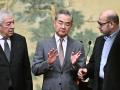 China's Foreign Minister Wang Yi gestures during an event hosting Mahmoud al-Aloul (not pictured), Vice Chairman of the Central Committee of Palestinian organisation and political party Fatah, and Mussa Abu Marzuk (not pictured), senior member of the Palestinian Islamist movement Hamas, at the Diaoyutai State Guesthouse in Beijing on July 23, 2024. China's Foreign Minister Wang Yi on July 23 hailed an agreement by 14 Palestinian factions to set up an "interim national reconciliation government" to govern Gaza after the war. (Photo by Pedro Pardo / AFP)