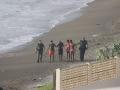 Marroquíes llegando a nado a la playa del Tarajal, en Ceuta, este mismo martes