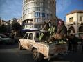 Aleppo (Syrian Arab Republic), 03/12/2024.- Syrians stand on the back of a tank on the Aleppo-Damascus International Highway M5 captured by the Syrian opposition, Syria, 03 December 2024. Syrian opposition forces, led by the Islamist militant group Hayat Tahrir al-Sham (HTS), launched an offensive on 27 November, taking large parts of Aleppo, Syria's second-largest city. The offensive triggered counterattacks by the Syrian regime forces as well as Russian and Syrian airstrikes on opposition-controlled areas. (Rusia, Siria, Damasco) EFE/EPA/MOHAMMED AL RIFAI