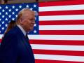 NEW YORK, NEW YORK - DECEMBER 12: President-elect Donald Trump walks onto the floor of the New York Stock Exchange (NYSE) with his wife Melania after being named TIMEs Person of the Year for the second time on December 12, 2024 in New York City. Trump followed a reception by ringing the opening bell on the trading floor.   Spencer Platt/Getty Images/AFP (Photo by SPENCER PLATT / GETTY IMAGES NORTH AMERICA / Getty Images via AFP)