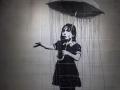 "La chica del paraguas" de Banksy, 2008, Nueva Orleans