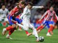 Real Madrid's Uruguayan midfielder #08 Federico Valverde shoots but fails to score during the UEFA Champions League Round of 16 second leg football match between Club Atletico de Madrid and Real Madrid CF at the Metropolitano stadium in Madrid on March 12, 2025. (Photo by Oscar DEL POZO CAÑAS / AFP)