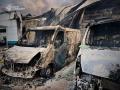 This handout photograph taken and released by Ukrainian State Emergency Service on May 18, 2025, shows burned vehicles parked near a civilian building following drone attacks on the Kyiv region, amid Russian invasion in Ukraine. Ukraine's air force said on May 18, it had intercepted 88 of 273 drones launched by Russia overnight, hitting in particular the Kyiv region. (Photo by Handout / Ukrainian State Emergency Service / AFP) / RESTRICTED TO EDITORIAL USE - MANDATORY CREDIT "AFP PHOTO /UKRAINIAN STATE EMERGENCY SERVICE " - HANDOUT - NO MARKETING NO ADVERTISING CAMPAIGNS - DISTRIBUTED AS A SERVICE TO CLIENTS