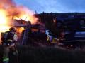 Los Bomberos de la Diputación de Soria trabajan en el incendio de un camión cargado de coches eléctricos
