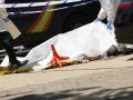 Agentes forenses se preparan para levantar el cuerpo del exdiputado ucraniano Andrey (Andriy) Portnov, tras ser asesinado a tiros frente al colegio de sus hijos en Pozuelo de Alarcón, cerca de Madrid