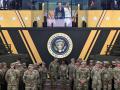 US President Donald Trump (C), flanked by US First Lady Melania Trump, administers the Oath of Enlistment to soldiers who are enlisting or reenlisting during the Army 250th Anniversary Parade in Washington, DC on June 14, 2025. (Photo by Mandel NGAN / AFP)