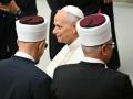Pope Leo XIV shakes hands with representants of different religions at the end of the Commemoration of the Conciliar Declaration "Nostra Aetate"  on the Churchs relations with non-Christian religions at Paul VI audience hall in The Vatican on October 28, 2025. (Photo by Alberto PIZZOLI / AFP)