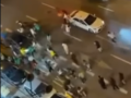 Imagen de los disturbios en la avenida del Puerto de Valencia por un grupo de senegaleses festejando el tirunfo en la Copa de África
