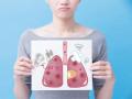 woman take unhealth lung billboard on the blue background