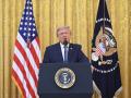 US President Donald Trump addresses the nation from the East Room of the White House in Washington, DC on July 16, 2026. (Photo by SAUL LOEB / POOL / AFP)